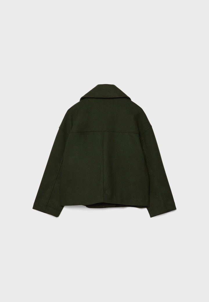 Fashionable women's double-breasted jacket worn casually. Lightweight & chic, perfect for elegant summer layering.