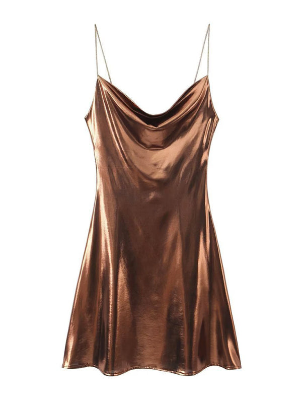 Women's seductive deep back dress with metallic straps, perfect for a glamorous night out.