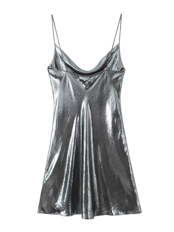 Stylish sleeveless party dress featuring a seductive deep back and metallic straps.