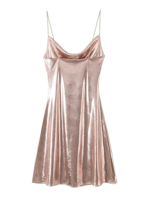 Elegant women's cocktail dress with deep back & metallic straps for evening wear.