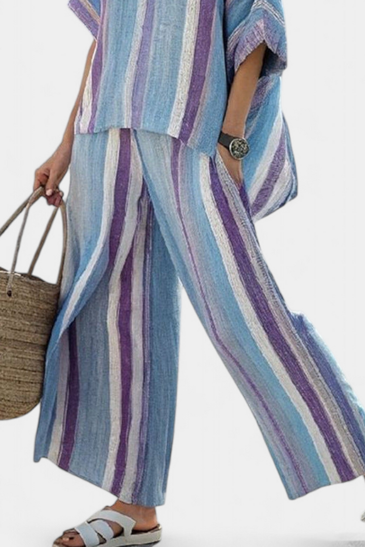 Women's two-piece set: flowy mauve pastel top & comfortable striped wide-leg pants for loungewear or travel.