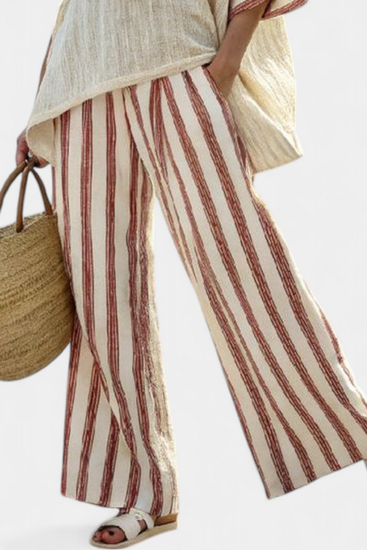 Chic women's striped top and wide-leg pant set. Elegant, comfortable two-piece outfit, ideal for travel and summer.