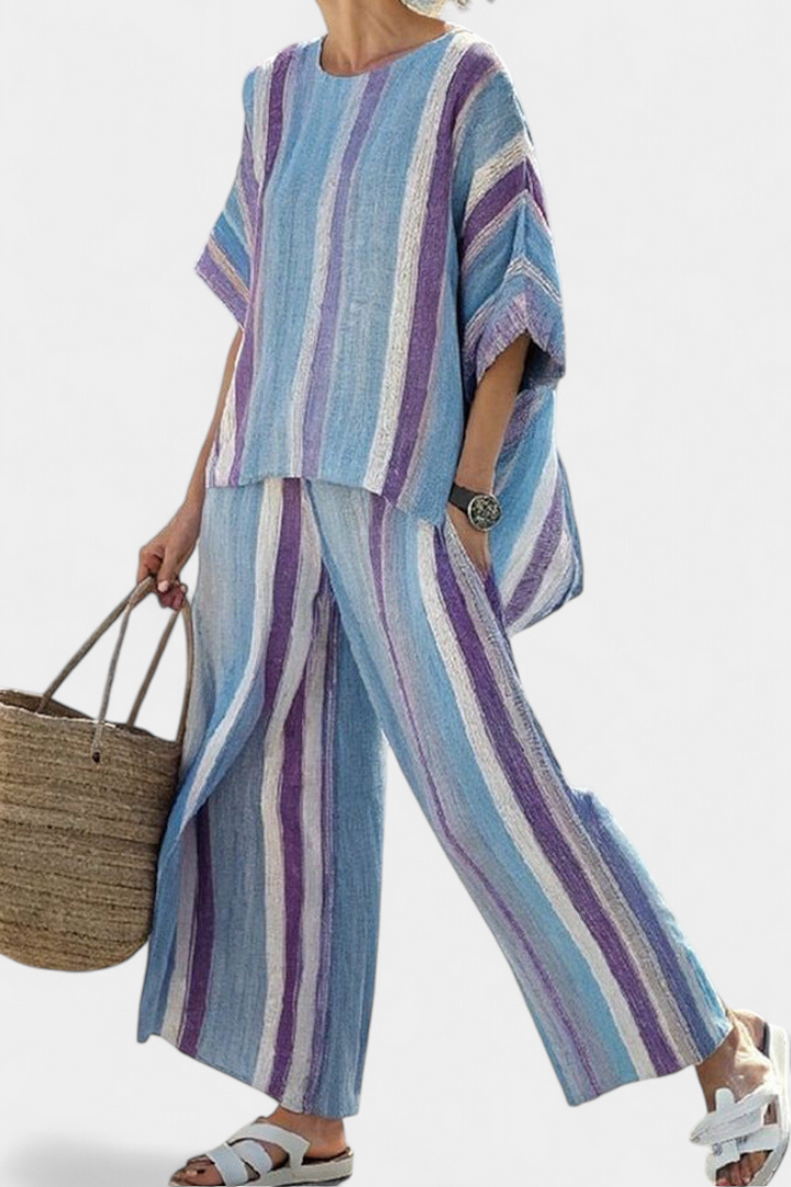 Women's elegant mauve pastel flowy top & striped wide-leg pants two-piece set for summer casual wear.