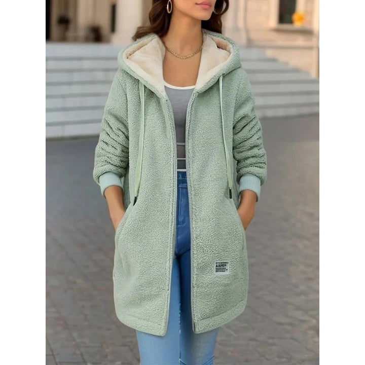 Women's outdoor hooded jacket, warm & stylish outerwear for winter adventures & casual wear.