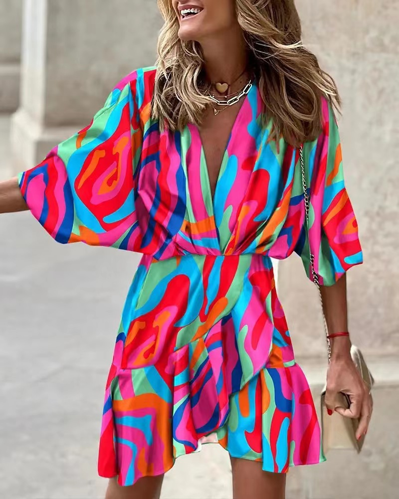 Flowy women's bohemian mini dress with ruffles, ideal for a stylish summer or casual outing.