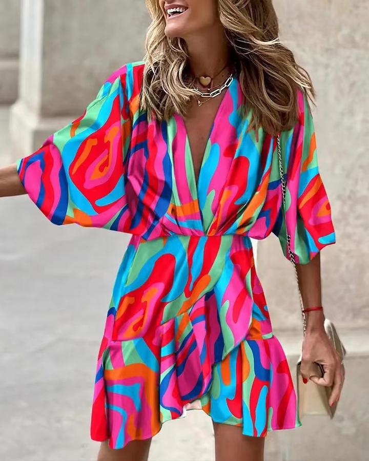 Flowy women's bohemian mini dress with ruffles, ideal for a stylish summer or casual outing.