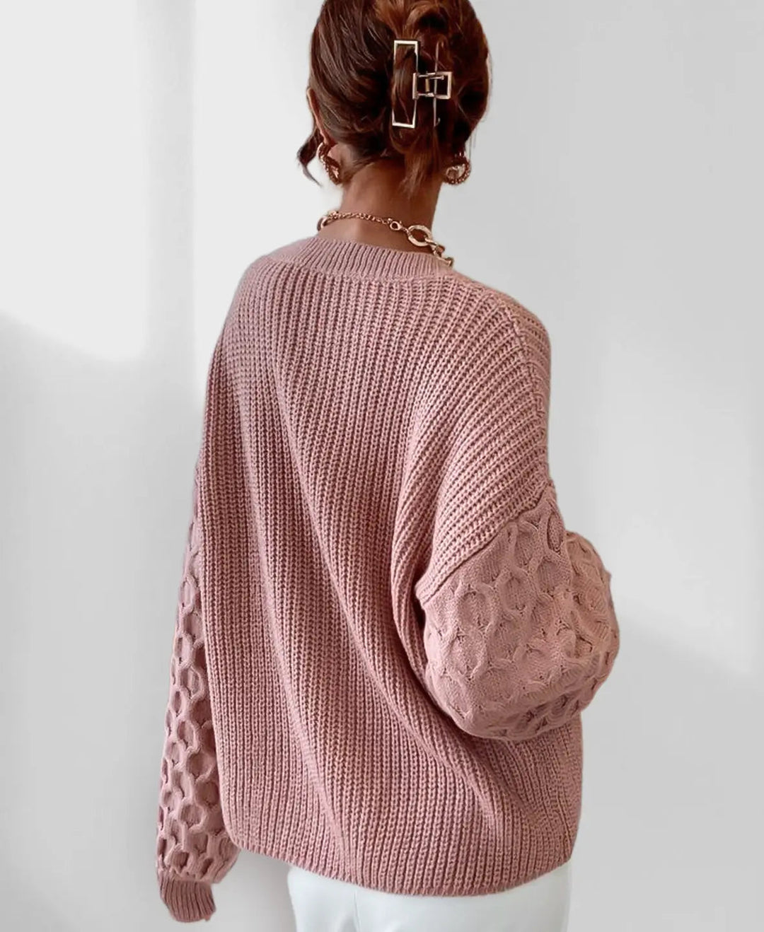 Close-up of the textured knit of the women's spring pullover, highlighting its cozy feel & quality.