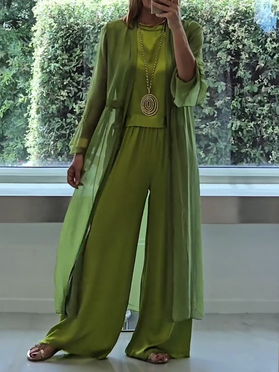 Elegant women's green three-piece lounge set. Features wide-leg pants, sleeveless top, and lightweight cardigan for comfort.