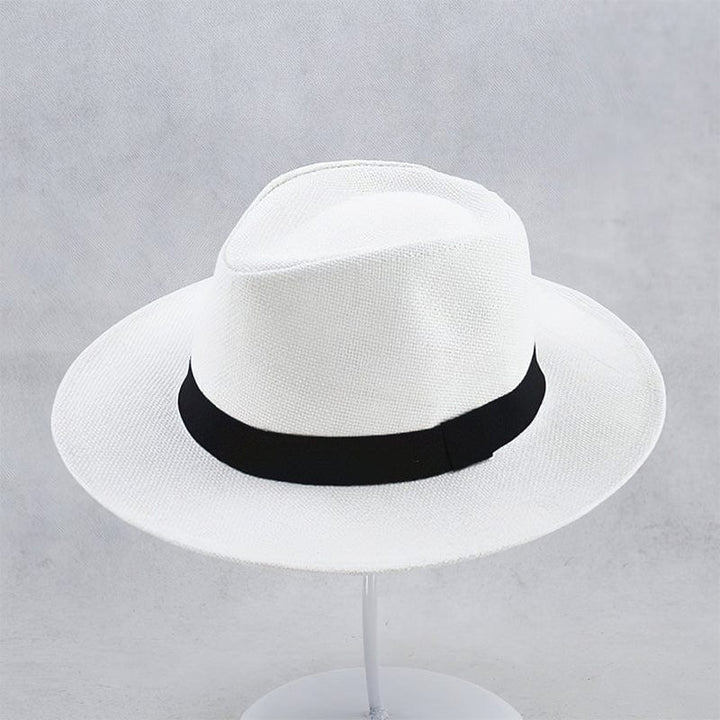 Unisex handmade Panama hat in natural straw, offering stylish sun protection for beach or summer days.