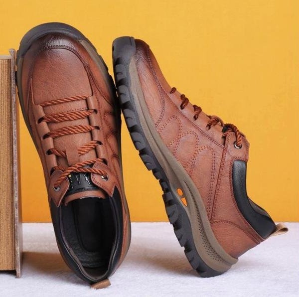 Durable men's low top lace-up shoes with a rugged textured finish, perfect for casual outfits.