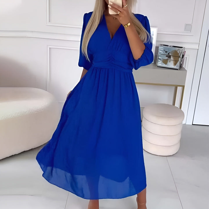 Flattering women's wrap midi dress, an elegant & comfortable choice for various events. Ladies' fashion essential.