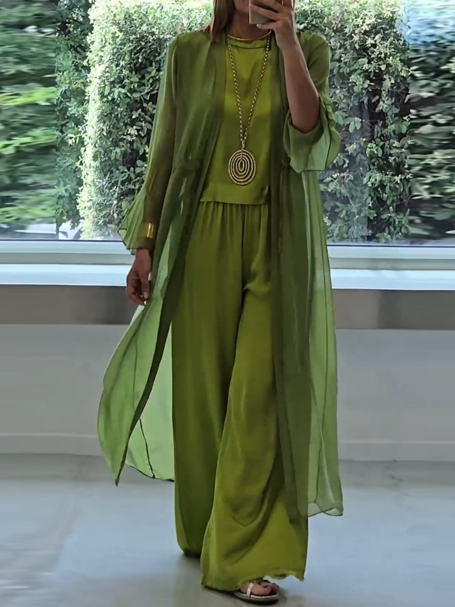 Comfortable green three-piece women's lounge set with relaxed fit, wide-leg pants, and soft sleeveless top.