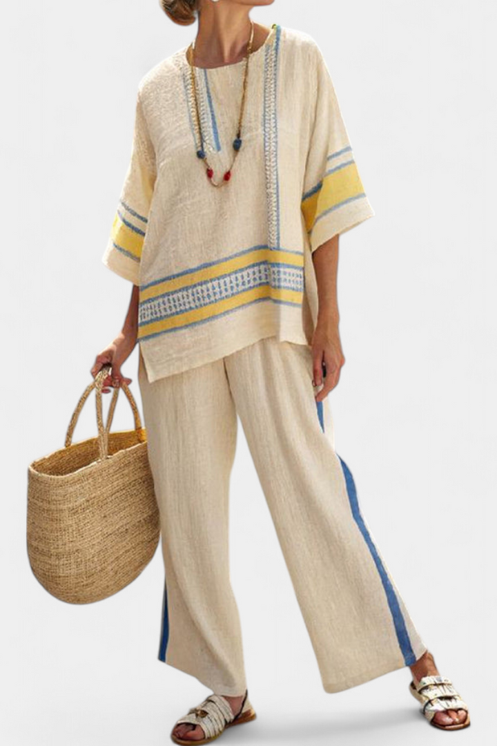 Women's blue-yellow Mediterranean two-piece set. Comfortable, flowy top & wide-leg pants for summer resort wear.