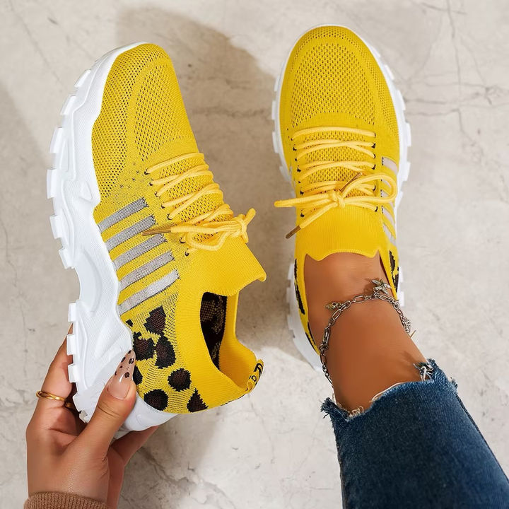 Women's athletic orthopaedic trainers, featuring a wide toe box and shock absorption for comfort.