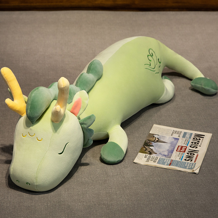 Plush unisex cuddle dragon body pillow, a soft comfort toy and unique gift idea for dragon lovers of all ages.