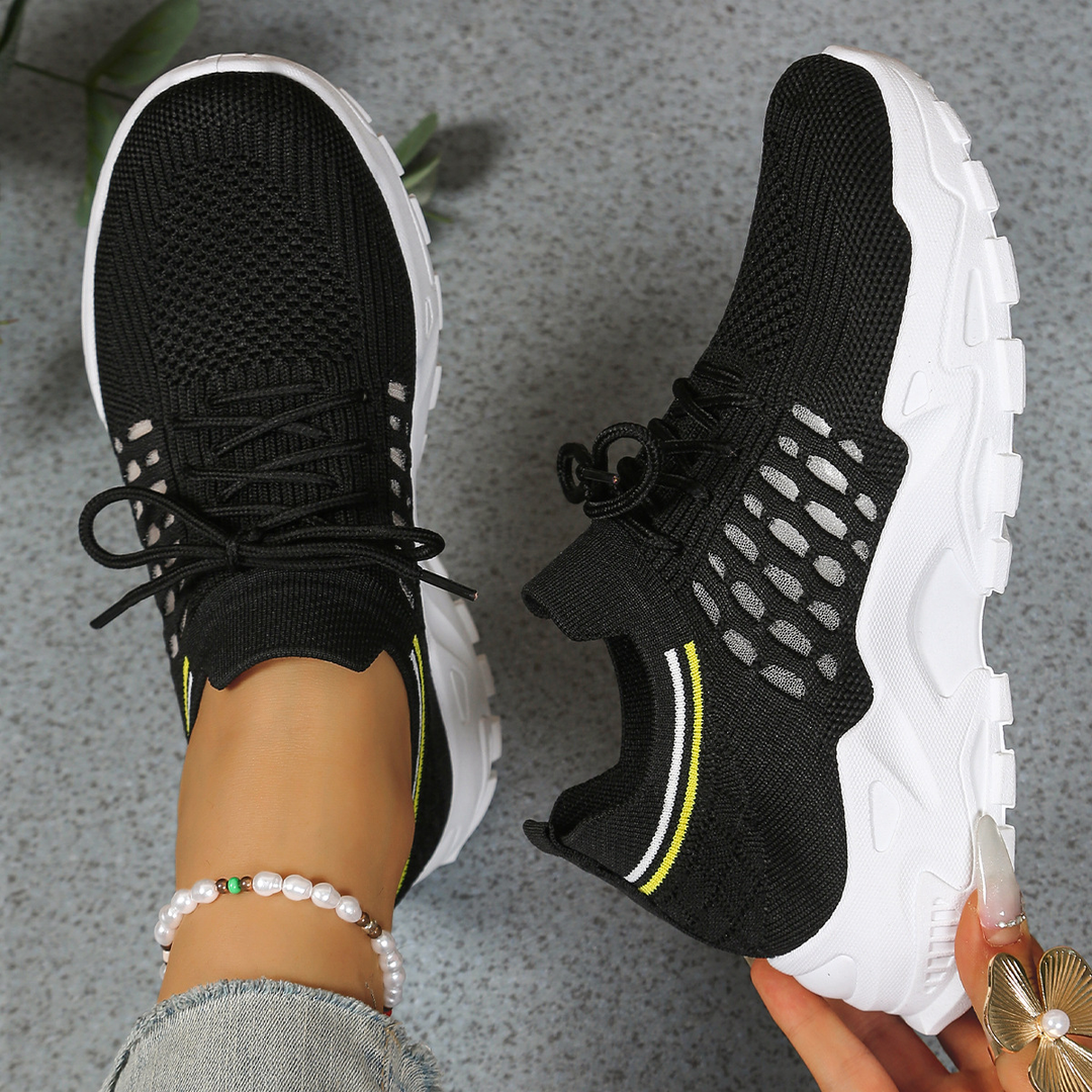 Comfortable women's sneakers with ergonomic design, wide toe box, and shock absorbing sole for walking.