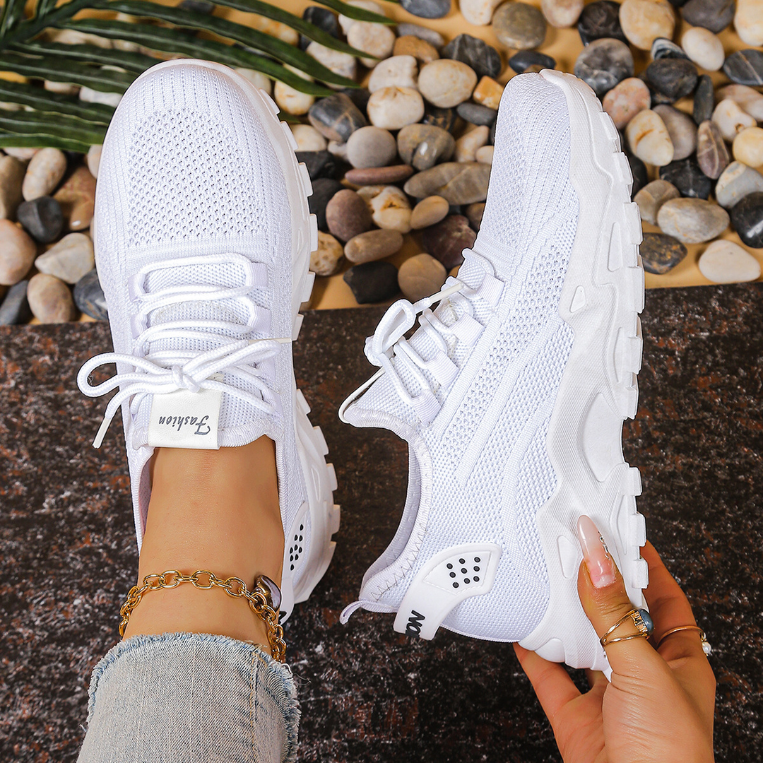 Ergonomic women's sneakers with arch support, great for walking and everyday casual footwear.