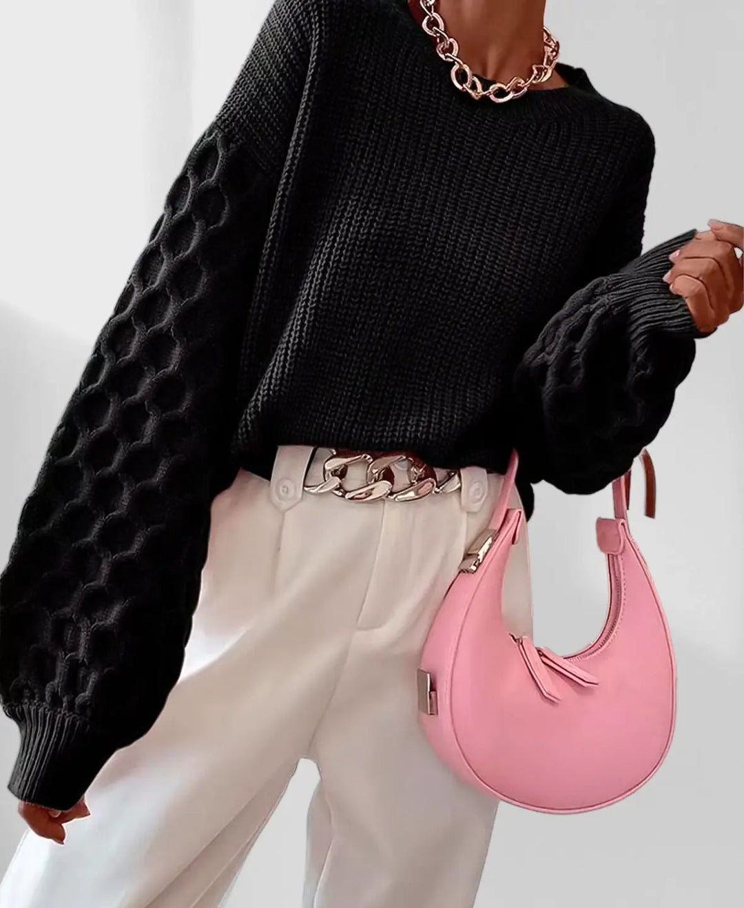 Happy woman wearing a cozy spring knit sweater, embodying comfort & chic style. Fashion pullover.