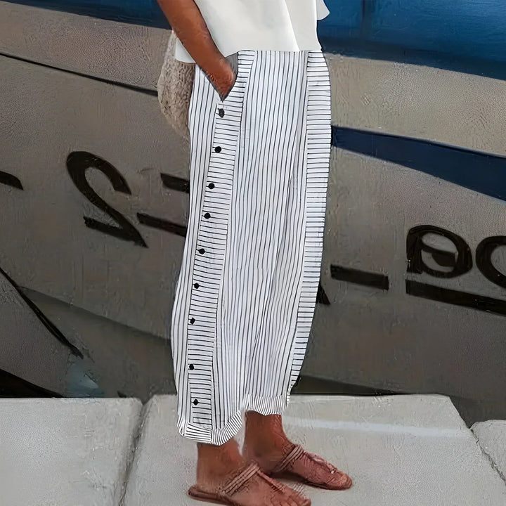 Stylish lightweight striped women's trousers with button accents. Versatile for relaxed casual outfits.