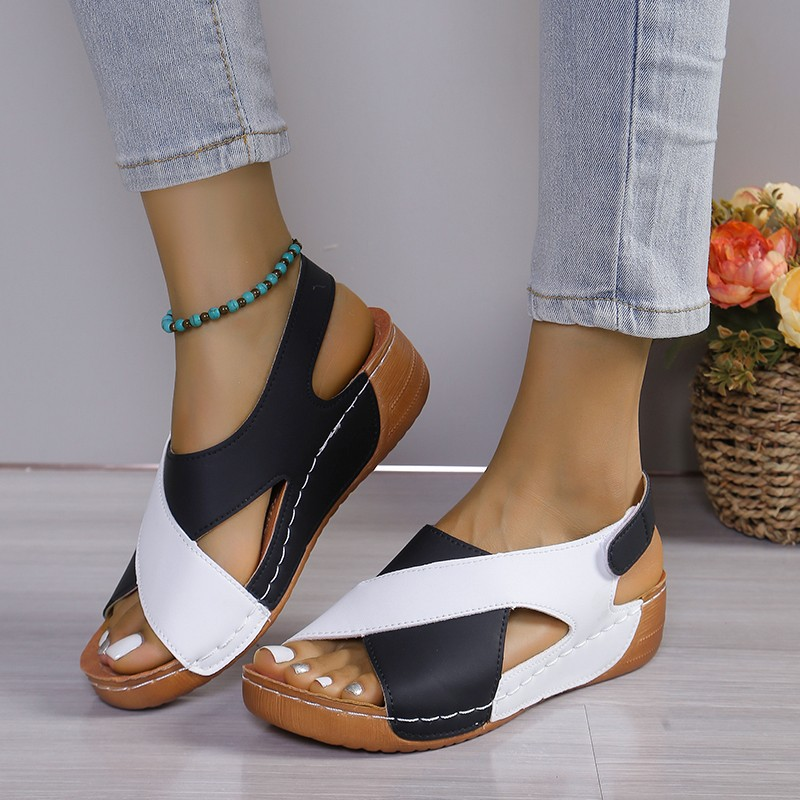 Women's comfortable wedge sandals, ideal everyday footwear for summer fashion. Features a stable platform & stylish design.