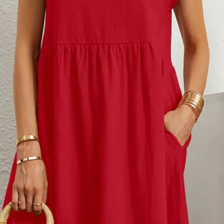 Comfortable women's casual midi dress, loose fit with practical pockets, for everyday style.
