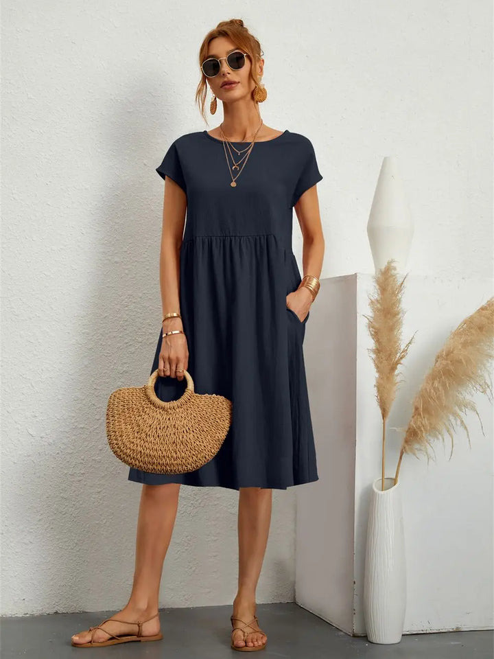 Comfortable & versatile women's midi dress with pockets, ideal for relaxed spring & summer looks.