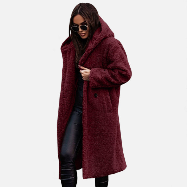 Warm women's elegant long plush winter coat, a chic and cozy fashion statement.