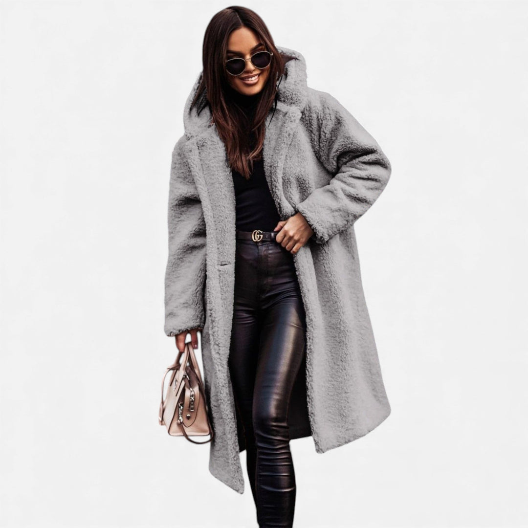 Luxurious plush long winter coat for women, warm and elegant fashion outerwear.