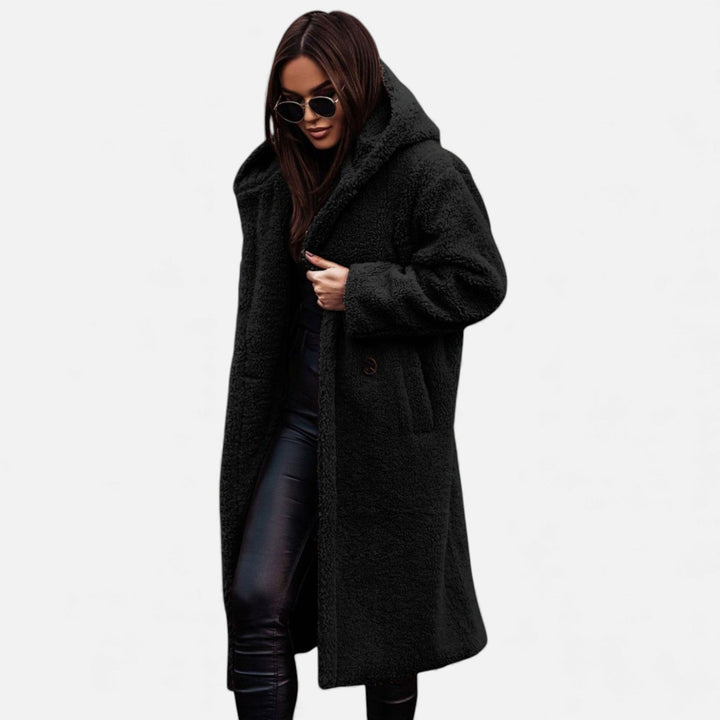 Stylish women's long plush winter coat, elegant design perfect for fashion-forward warmth.