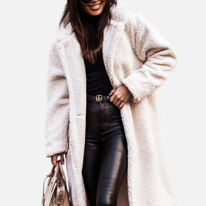 Warm women's long plush winter outerwear, elegant and cozy for cold days.