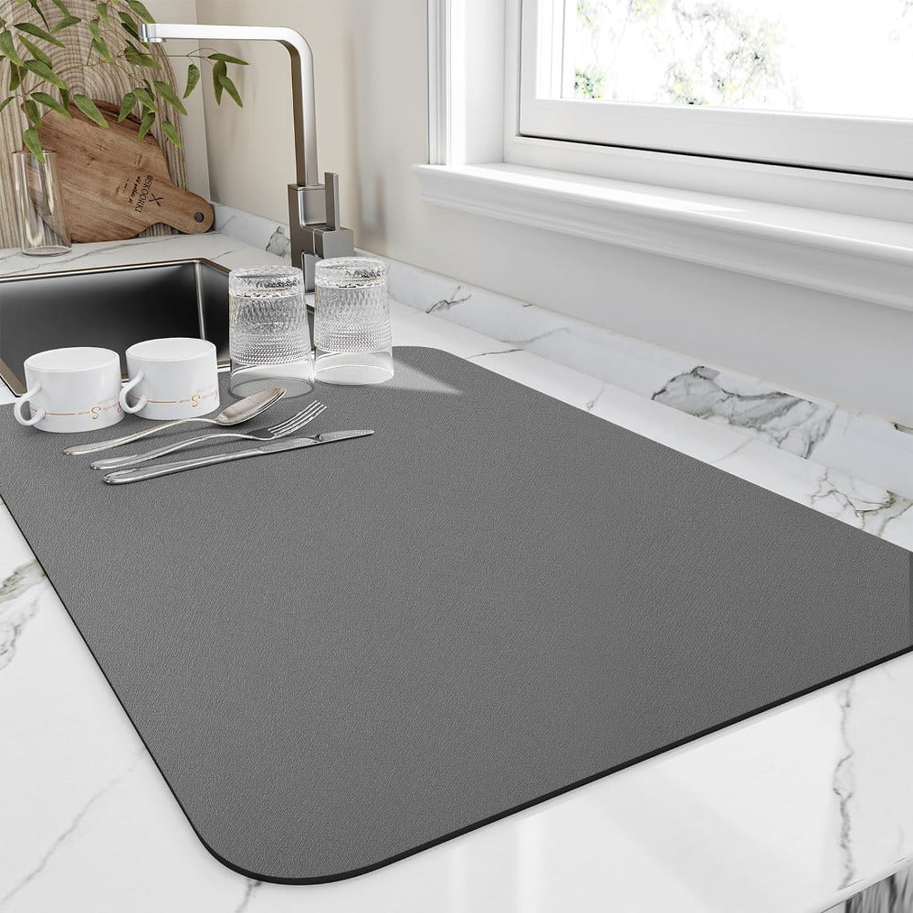 Fast-drying diatomaceous draining mat for kitchen counter. Ultra absorbent sink mat, perfect for dish drying.