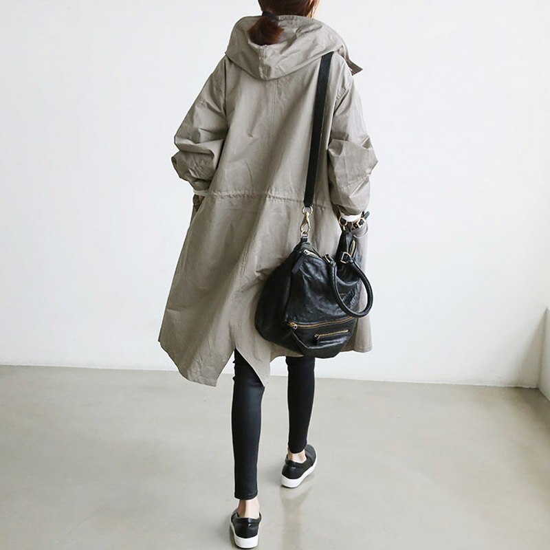 Elegant women's waterproof trench coat. Classic style outerwear, perfect for versatile all-weather fall & spring fashion.