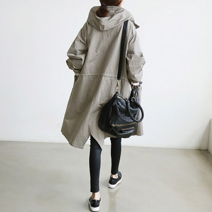 Elegant women's waterproof trench coat. Classic style outerwear, perfect for versatile all-weather fall & spring fashion.
