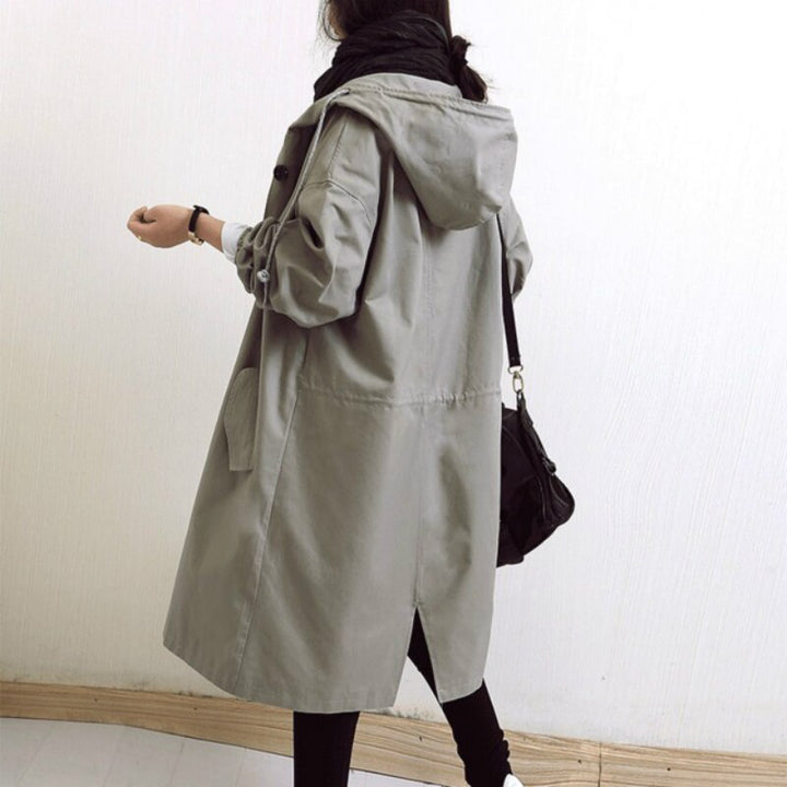 Chic women's waterproof trench coat. Elegant outerwear jacket for spring, fall, and rainy conditions. Classic style.