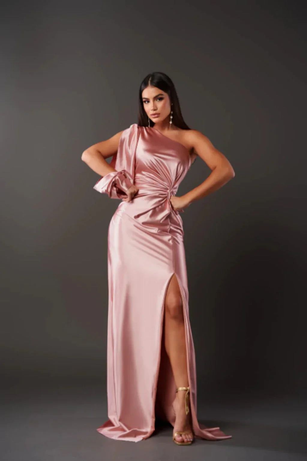Women's elegant one-shoulder formal dress, styled for a glamorous special occasion look.