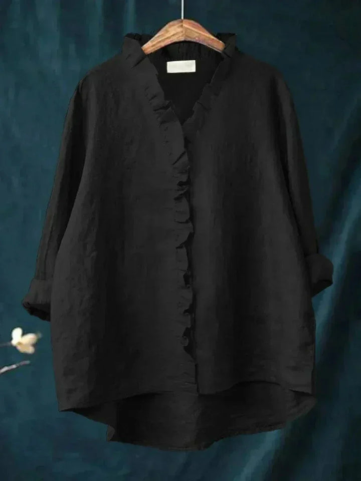 Everyday comfort in a stylish women's long-sleeve ruffled blouse, perfect for work or casual occasions.