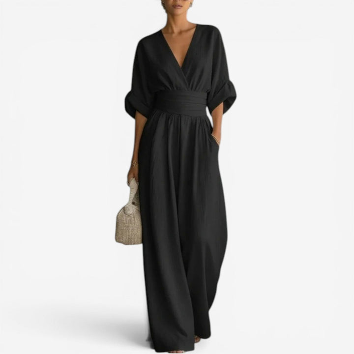 Elegant women's jumpsuit featuring a flattering V-neck and trendy wide sleeves for modern fashion.