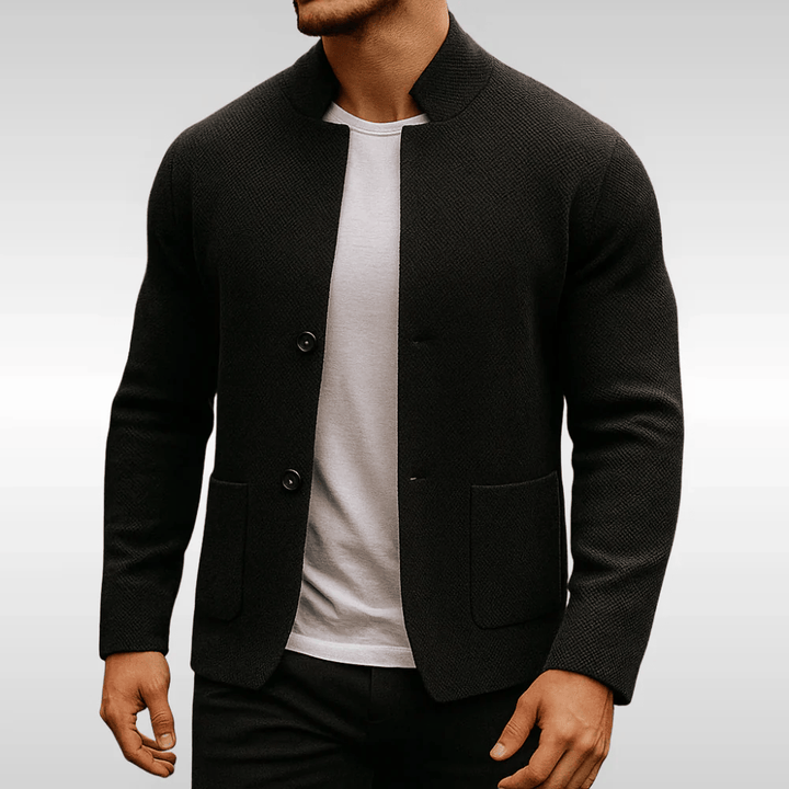 Classic black men's textured cardigan, featuring practical front pockets for modern smart casual looks.