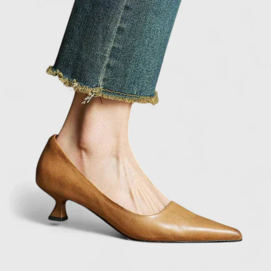 Close-up of a women's orthopedic heel, showcasing elegant design & quality for comfortable dress shoes.