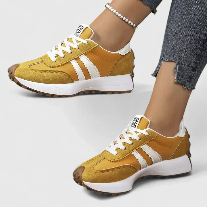 Black women's orthopaedic walking trainers with arch support, ideal for everyday comfort and casual style.