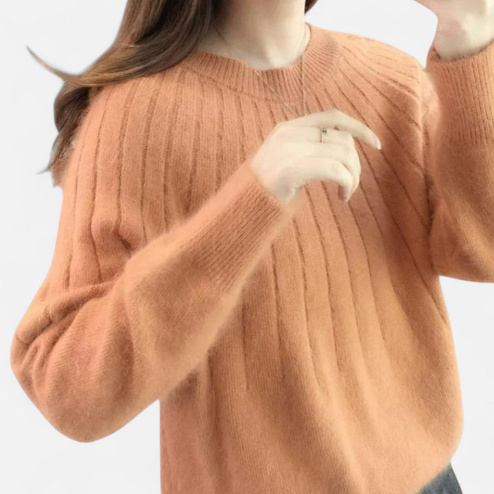 Timeless women's knit sweater, perfect for achieving an elegant, comfortable, and chic everyday look.