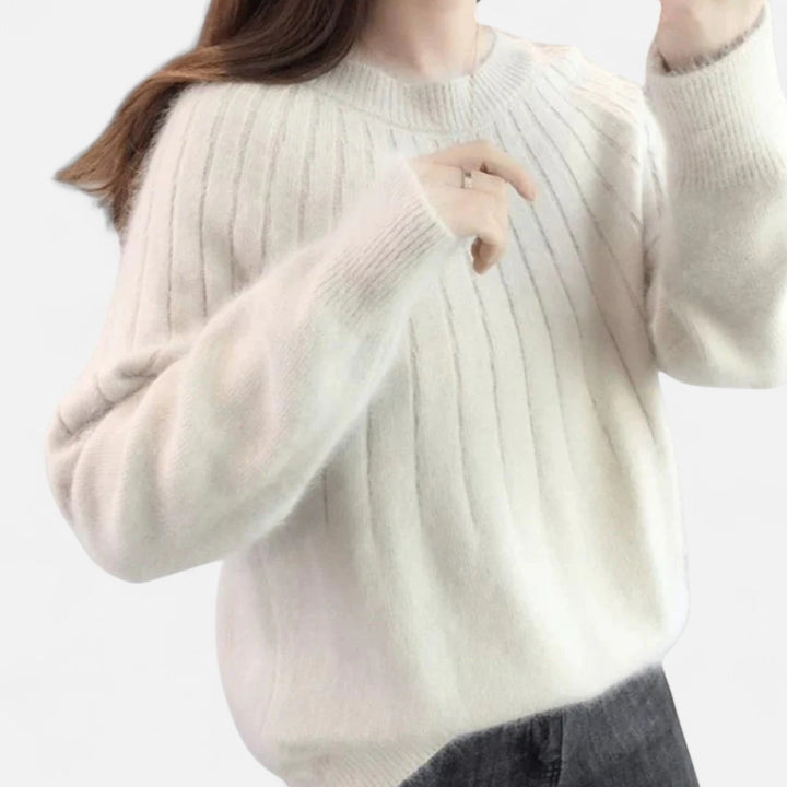 Warm women's pullover sweater with a cozy knit texture, designed for lasting comfort and versatile style.