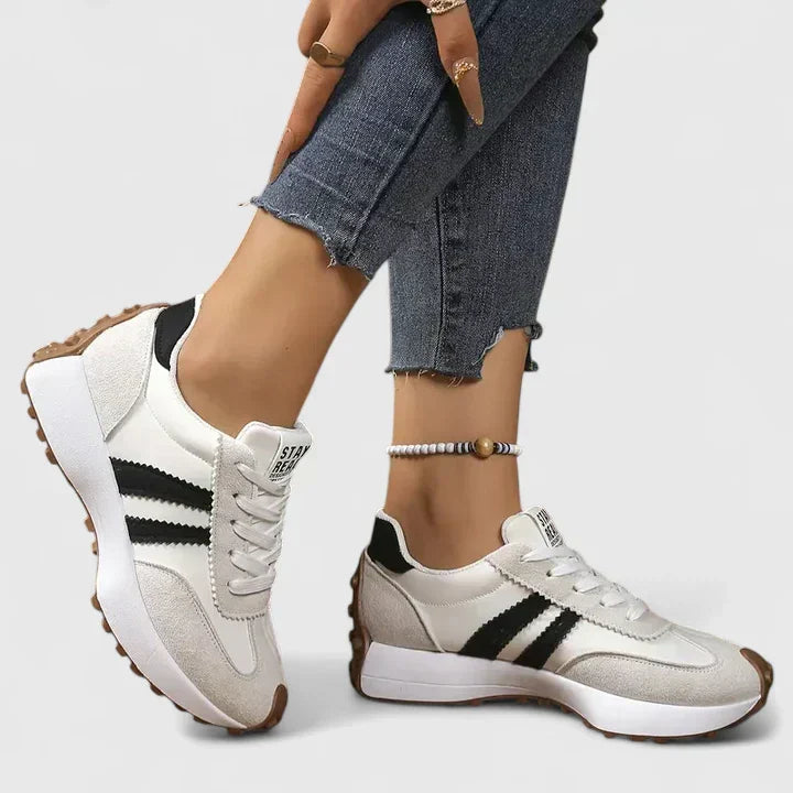 Lightweight women's orthopaedic sneakers with excellent arch support, ensuring all-day comfort for walking.