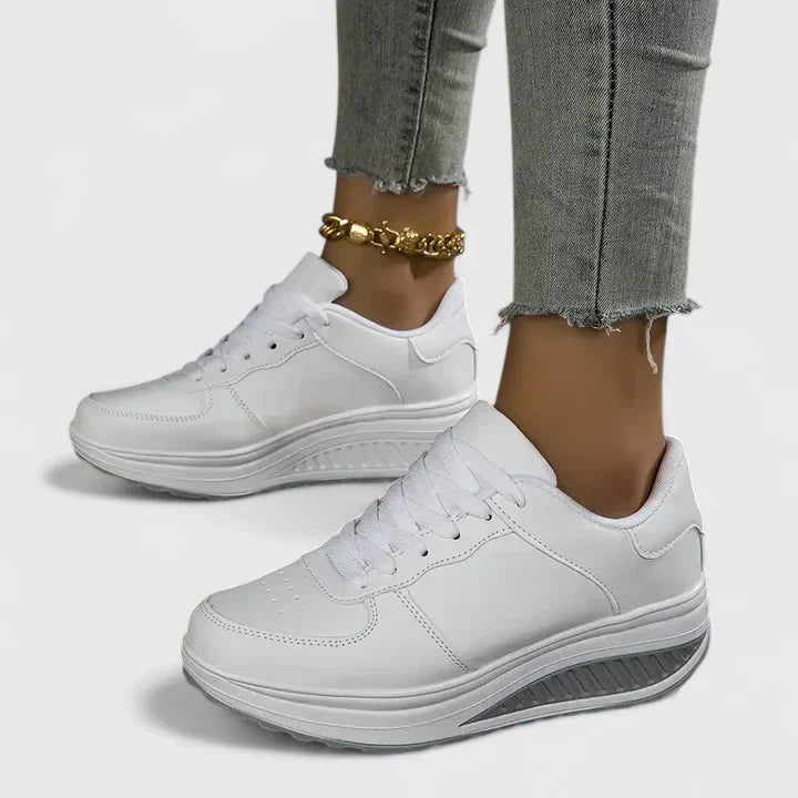 Close-up of comfortable women's orthopaedic trainers, highlighting arch support for walking & all-day comfort.