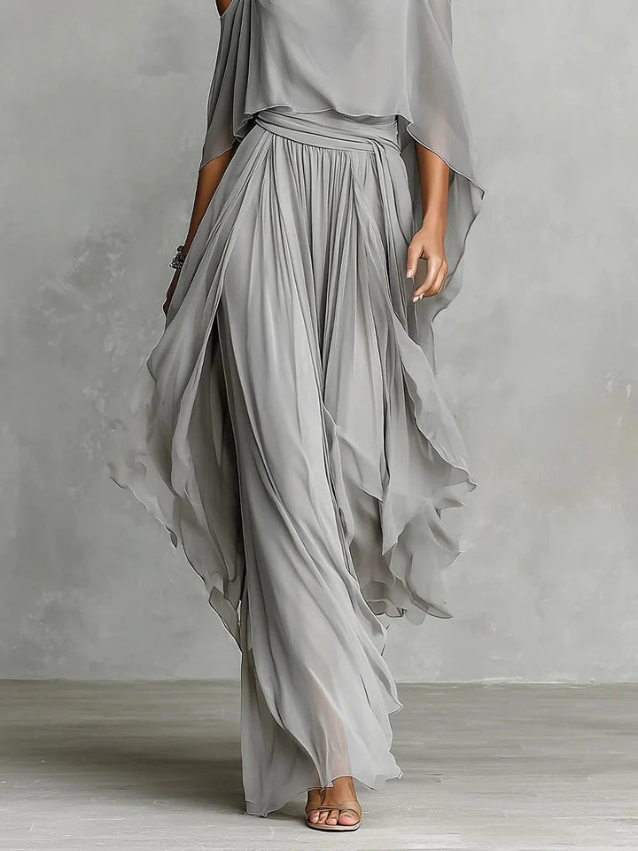Fashionable women's off-shoulder top and flowy wide-leg trousers, an elegant grey two-piece set for summer.