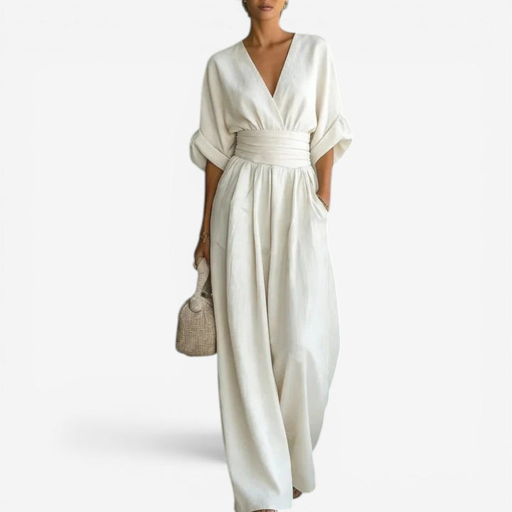 Stylish women's V-neck jumpsuit with flowy wide sleeves, offering comfortable and sophisticated fashion.