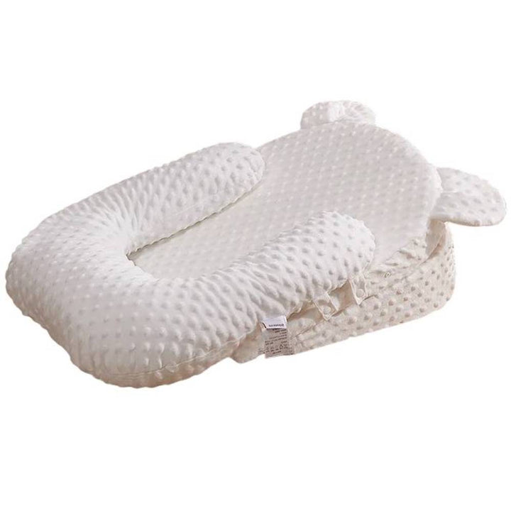 Infant anti-reflux feeding pillow, designed for comfortable baby feeding & spit-up prevention. Soft, supportive newborn cushion.