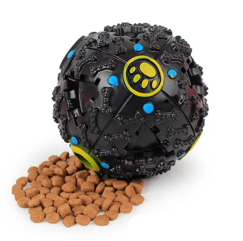 Dog playing with an interactive squeaky ball, designed for treat dispensing and durable play.