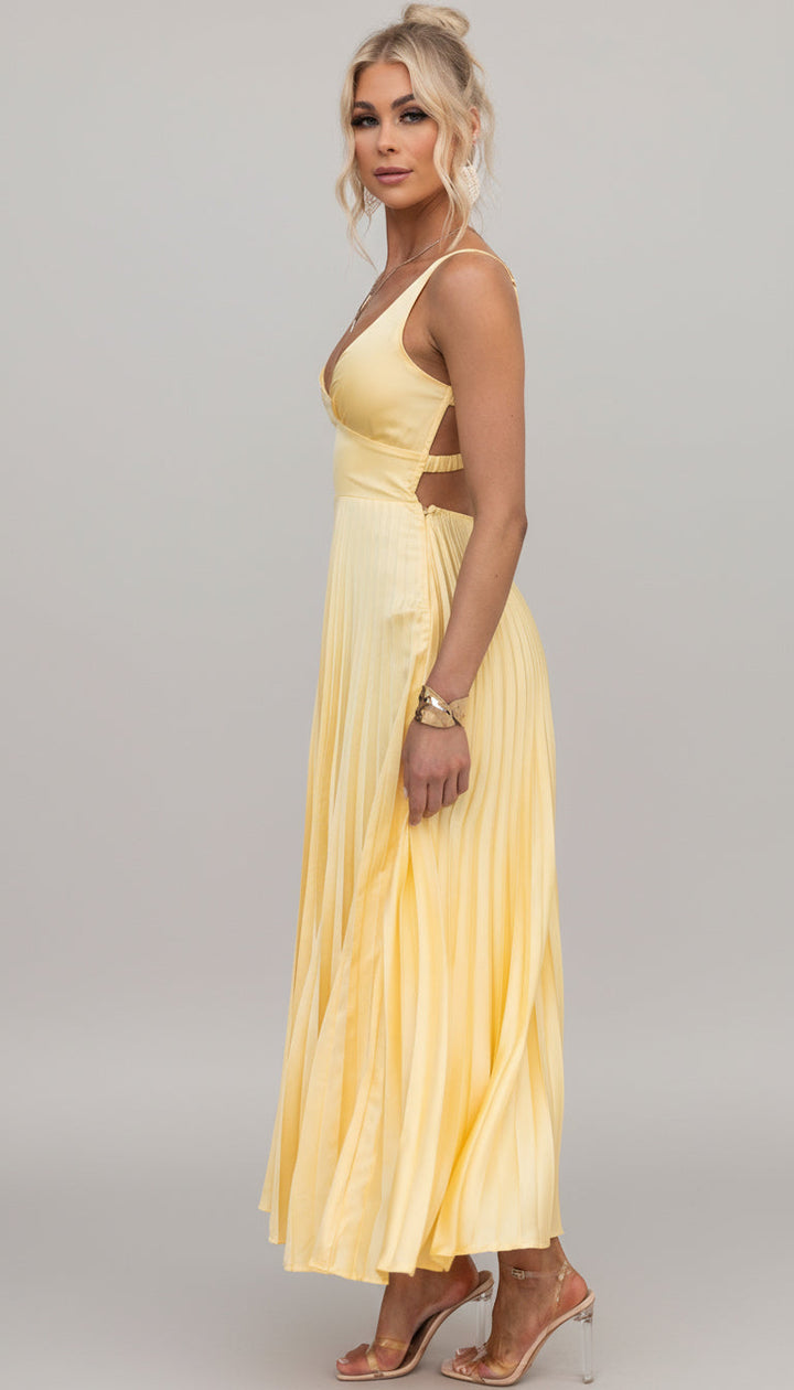 Feminine V-neck pleated maxi dress, an elegant flowing summer gown for women, suitable for any special occasion.