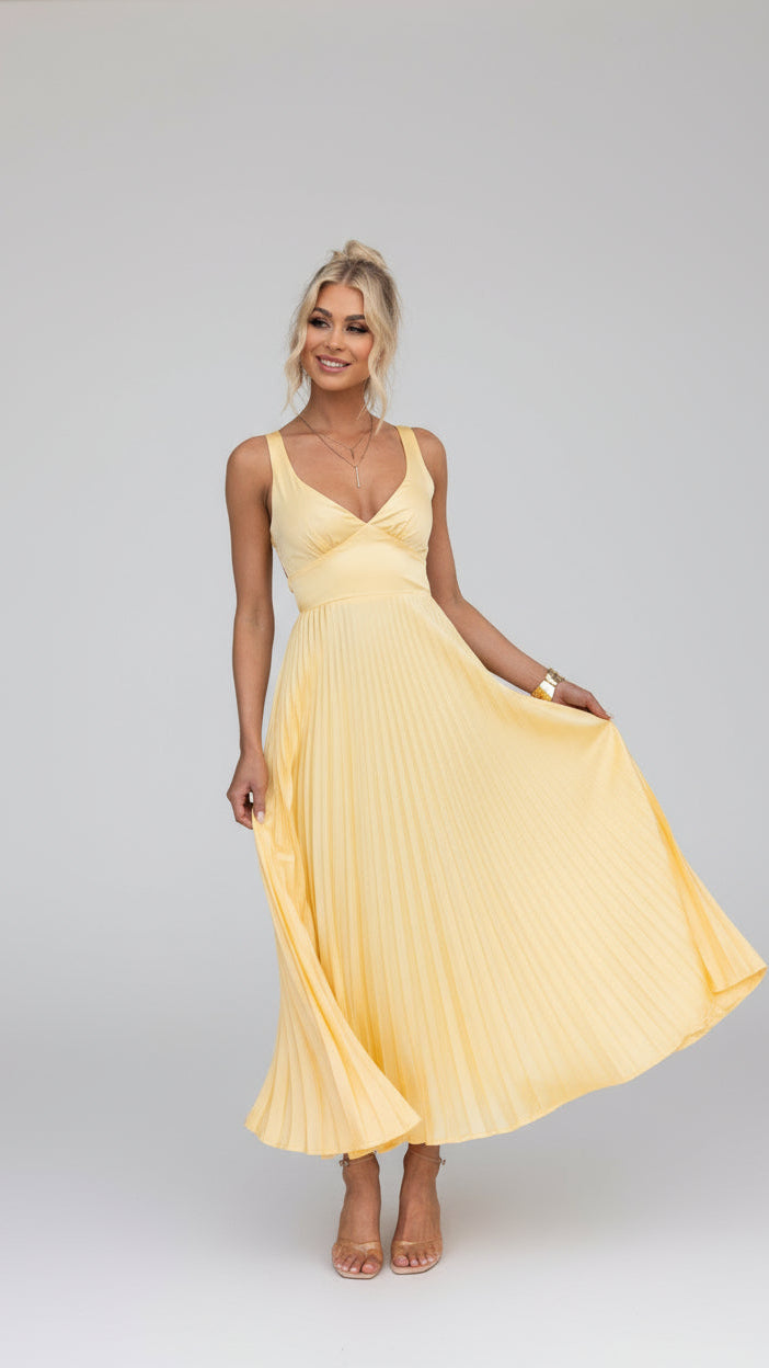 Elegant women's flowing maxi dress with v-neck and pleated skirt, perfect for summer occasions and evening wear.